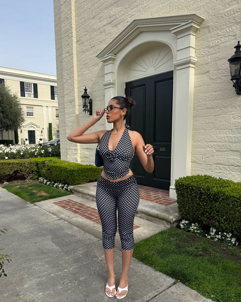 https://cdn.shopify.com/s/files/1/0293/9277/files/03-30-26_Just_A_Girl_Polka_Dot_Halter_Top_Capri_Set_Black-White_063_CM.jpg?v=1780955277&with=400&height=600